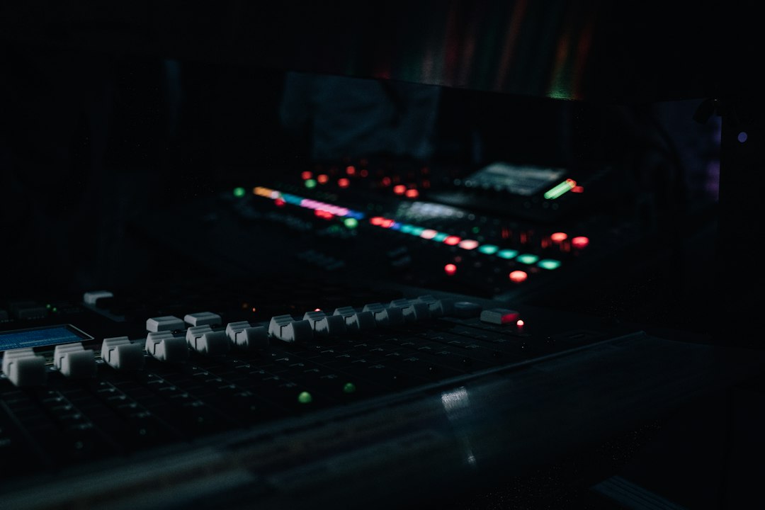 Conceptual cover showing movie sound design workflow with a mixing console, waveforms, and a clapperboard